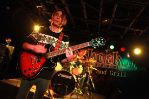 Senior Dakota Jafferis plays guitar and sings at The Aftershock Bar and Grill. Photo by Natalie Pasley