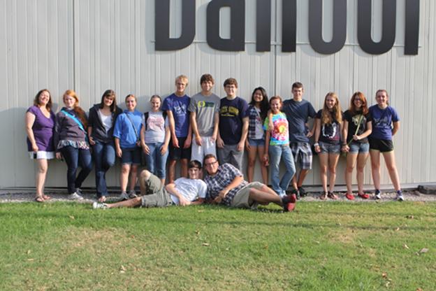 North students and journalism teacher, Becky Tate in front of Norths yearbook publisher, Balfour in Dallas. 