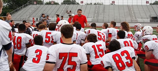Varsity+football+coach+Ben+Bartlett+talks+to+football+team+prior+to+a+scrimmage+held+on+August+28th.
