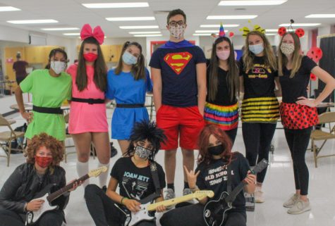 All three teams stand posed for a group picture after the games had been finished. It was really Abby [Rankins] idea to be the Powerpuff Girls, junior Rosabelle Vega said. (photo by Abby Schiller)