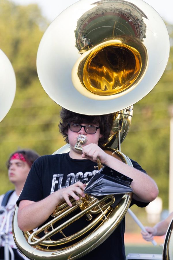 Carrying the band, Junior Aiden Elliot plays the sousaphone during the Fall Sports Kickoff. I was just trying to focus on tempo and also keeping in time with the drum cadences. Elliot said.
Photo by Teryn DeBey