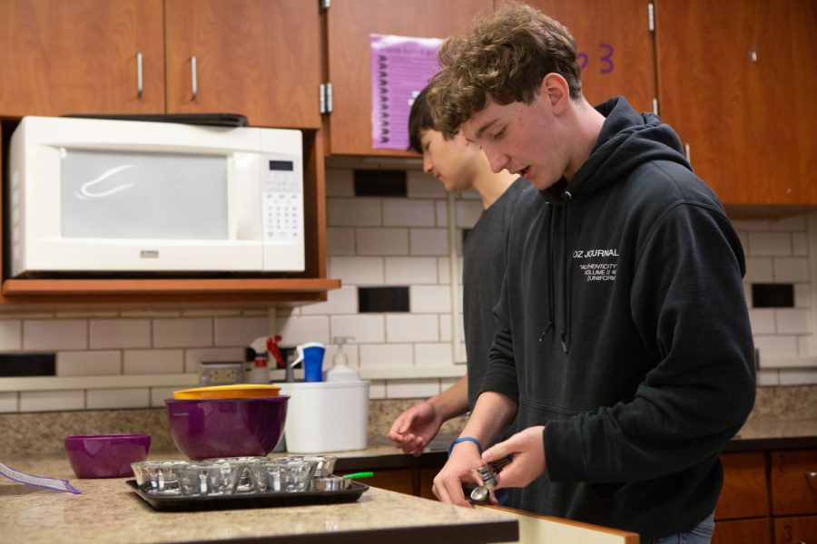 Assembling for the lab, Sophomore, Oliver Fein assembles his station and finds measuring cups, and tablespoons “This lab was the best experience I’ve had in foods class said Fein.