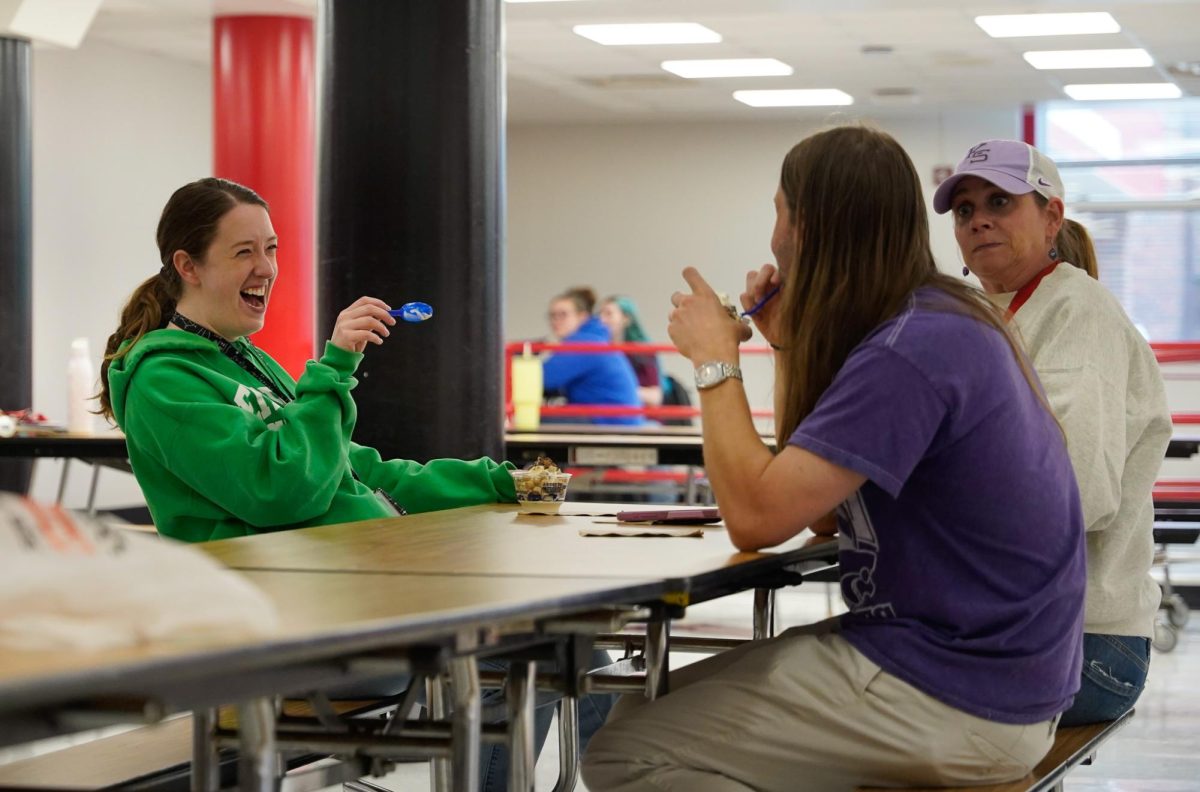 Laughing at a funny joke, math teacher Libby Davis chats with teacher friends and enjoys ice cream specially given from Culver's as a teacher appreciation week treat. “The end of the school year is so stressful, so being able to sit down, relax, and laugh with friends is necessary. We appreciated being appreciated,” said Davis. 